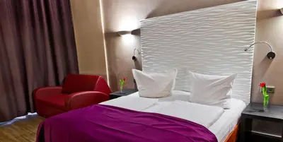 Ein Bett oder Betten in einem Zimmer der Unterkunft Artim Hotel