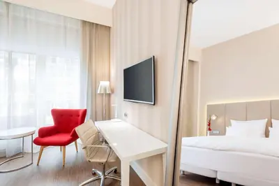 Ein Bett oder Betten in einem Zimmer der Unterkunft NH Collection Berlin Mitte Friedrichstrasse