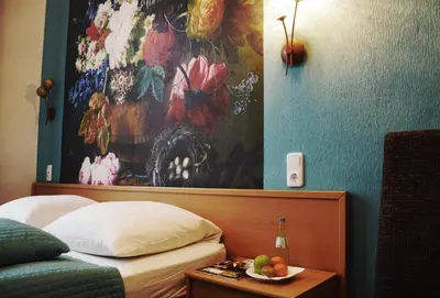 Ein Bett oder Betten in einem Zimmer der Unterkunft Hotel Pension Bella