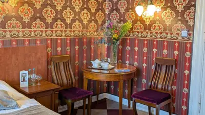 Ein Sitzbereich in der Unterkunft Hotel Pension Bella