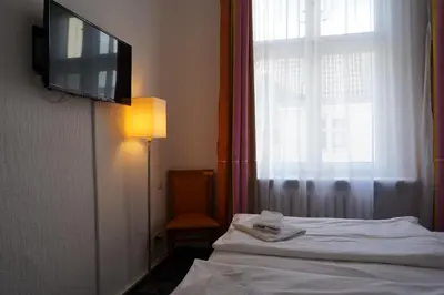 Ein Bett oder Betten in einem Zimmer der Unterkunft Hotel Ambert