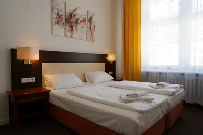 Ein Bett oder Betten in einem Zimmer der Unterkunft Hotel Ambert