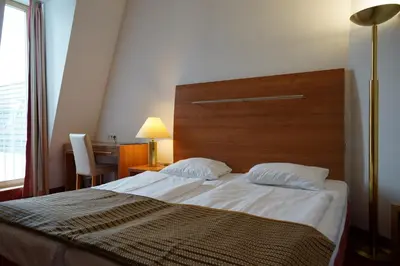 Ein Bett oder Betten in einem Zimmer der Unterkunft Hotel Ambert
