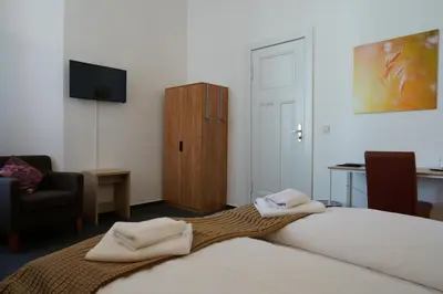 Ein Bett oder Betten in einem Zimmer der Unterkunft Hotel Ambert