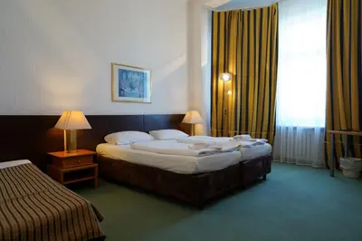 Ein Bett oder Betten in einem Zimmer der Unterkunft Hotel Ambert