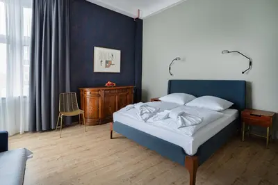 Ein Bett oder Betten in einem Zimmer der Unterkunft Hotel BELLEVUE am Kurfürstendamm