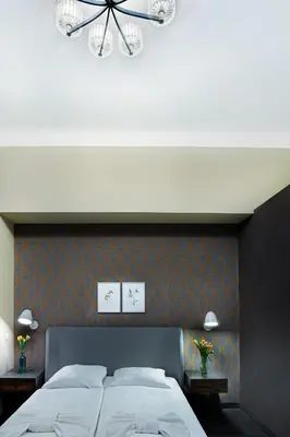 Ein Bett oder Betten in einem Zimmer der Unterkunft Hotel BELLEVUE am Kurfürstendamm