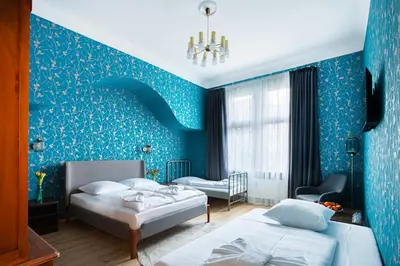 Ein Bett oder Betten in einem Zimmer der Unterkunft Hotel BELLEVUE am Kurfürstendamm