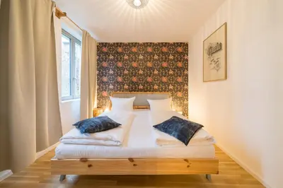 Ein Bett oder Betten in einem Zimmer der Unterkunft Design Apartments - 