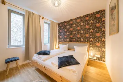 Ein Bett oder Betten in einem Zimmer der Unterkunft Design Apartments - 