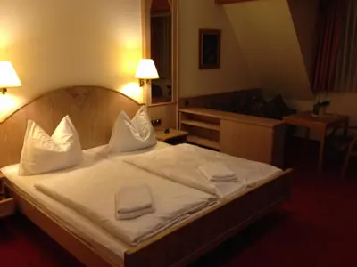 Ein Bett oder Betten in einem Zimmer der Unterkunft Hotel 