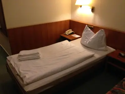 Ein Bett oder Betten in einem Zimmer der Unterkunft Hotel 