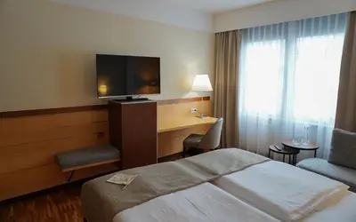Ein Bett oder Betten in einem Zimmer der Unterkunft centrovital Hotel Berlin