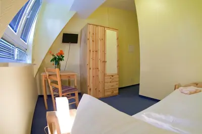 Ein Bett oder Betten in einem Zimmer der Unterkunft Hotel Atlantic
