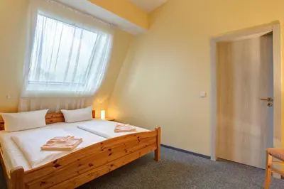 Ein Bett oder Betten in einem Zimmer der Unterkunft Hotel Atlantic