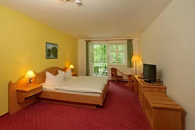 Ein Bett oder Betten in einem Zimmer der Unterkunft Hotel Boltenmühle
