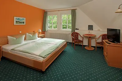 Ein Bett oder Betten in einem Zimmer der Unterkunft Hotel Boltenmühle