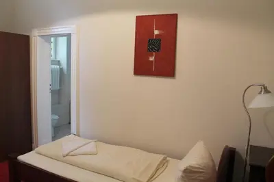 Ein Bett oder Betten in einem Zimmer der Unterkunft Hotel Pension Kima