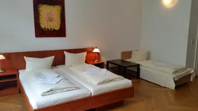 Ein Bett oder Betten in einem Zimmer der Unterkunft Hotel Pension Kima
