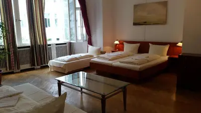 Ein Bett oder Betten in einem Zimmer der Unterkunft Hotel Pension Kima
