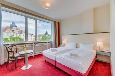 Ein Bett oder Betten in einem Zimmer der Unterkunft Come Inn Berlin Kurfürstendamm
