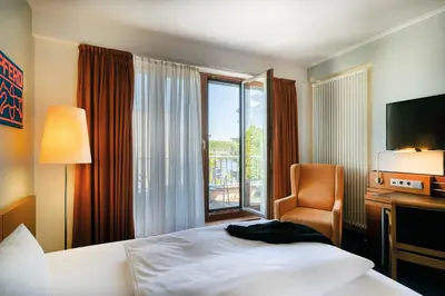 Ein Bett oder Betten in einem Zimmer der Unterkunft Seminaris Avendi Hotel Potsdam