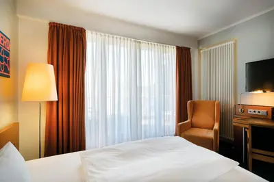 Ein Bett oder Betten in einem Zimmer der Unterkunft Seminaris Avendi Hotel Potsdam