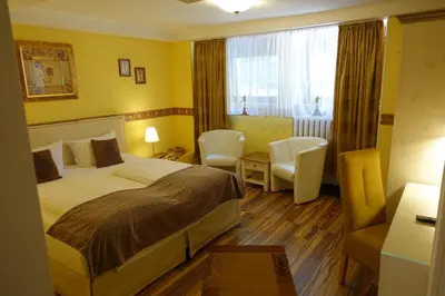 Ein Bett oder Betten in einem Zimmer der Unterkunft Hotel Villa Konstanz
