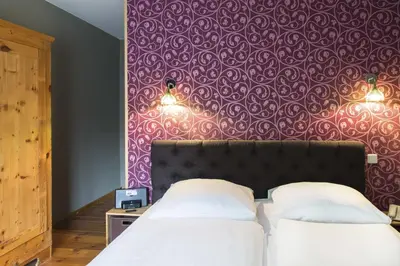 Ein Bett oder Betten in einem Zimmer der Unterkunft Hotel Residenz Begaswinkel
