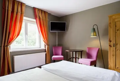 Ein Bett oder Betten in einem Zimmer der Unterkunft Hotel Residenz Begaswinkel