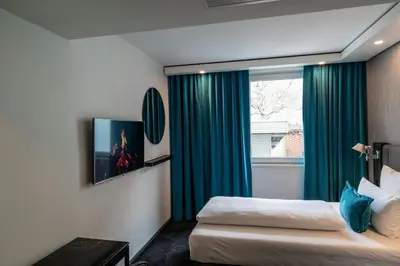 Ein Bett oder Betten in einem Zimmer der Unterkunft Motel One Berlin Mitte