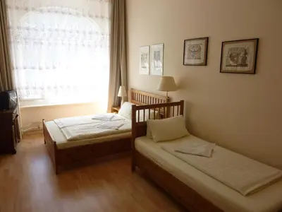 Ein Bett oder Betten in einem Zimmer der Unterkunft Hotel Pension Waizenegger am Kurfürstendamm