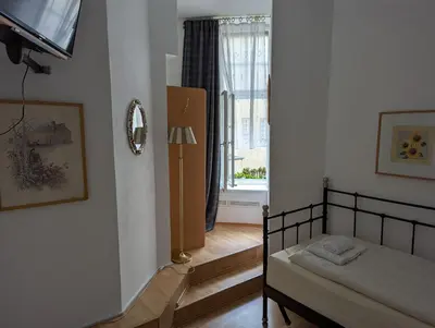 Ein Bett oder Betten in einem Zimmer der Unterkunft Hotel Pension Waizenegger am Kurfürstendamm