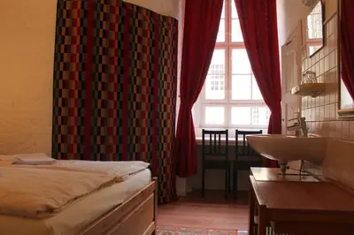 Ein Bett oder Betten in einem Zimmer der Unterkunft Hotel Pension Waizenegger am Kurfürstendamm