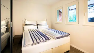 Ein Bett oder Betten in einem Zimmer der Unterkunft Parkresidenz Lychen, Ferienwohnung 9