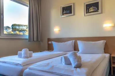Ein Bett oder Betten in einem Zimmer der Unterkunft Familienhotel Citylight
