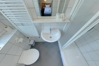 Ein Badezimmer in der Unterkunft Familienhotel Citylight
