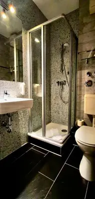 Ein Badezimmer in der Unterkunft ALFA Hotel