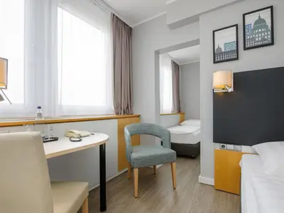 Ein Bett oder Betten in einem Zimmer der Unterkunft Mercure Hotel Potsdam City