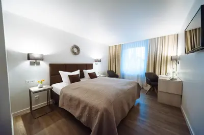 Ein Bett oder Betten in einem Zimmer der Unterkunft Landhotel Potsdam
