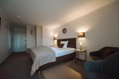 Ein Bett oder Betten in einem Zimmer der Unterkunft Landhotel Potsdam
