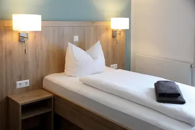 Ein Bett oder Betten in einem Zimmer der Unterkunft Businesshotel Berlin