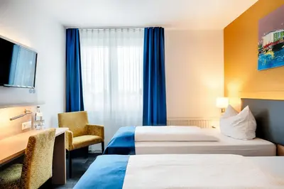 Ein Bett oder Betten in einem Zimmer der Unterkunft Businesshotel Berlin
