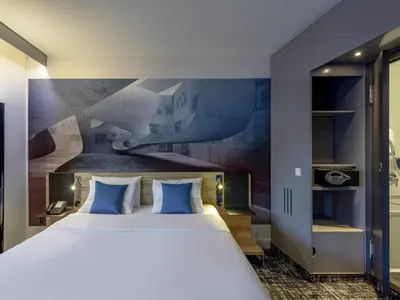 Ein Bett oder Betten in einem Zimmer der Unterkunft Novotel Suites Berlin City Potsdamer Platz
