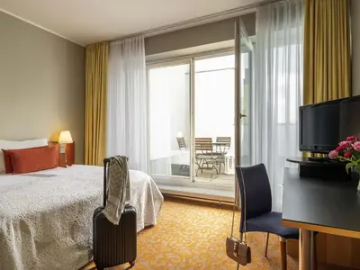 Ein Bett oder Betten in einem Zimmer der Unterkunft Mercure Hotel & Residenz Berlin Checkpoint Charlie