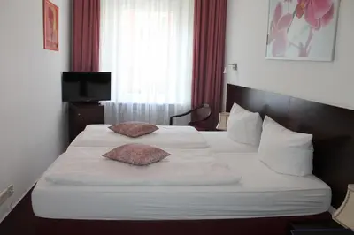 Ein Bett oder Betten in einem Zimmer der Unterkunft Hotel Novalis