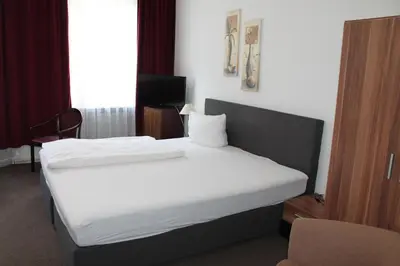 Ein Bett oder Betten in einem Zimmer der Unterkunft Hotel Novalis
