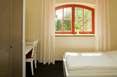 Ein Bett oder Betten in einem Zimmer der Unterkunft Kulturgasthof Alte Reederei