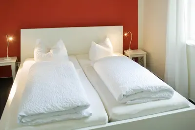 Ein Bett oder Betten in einem Zimmer der Unterkunft Kulturgasthof Alte Reederei
