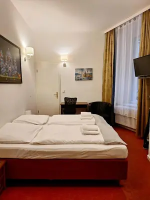 Ein Bett oder Betten in einem Zimmer der Unterkunft Hotel Amelie Berlin